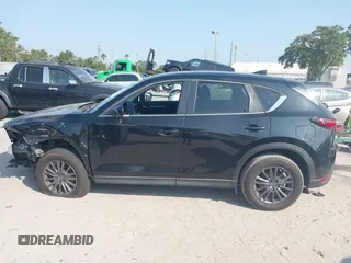 2020 Mazda CX-5 Touring with VIN JM3KFACM2L0770241, listed as a IAAI auction lot 42186952 with 41,590 mi miles and . Bid and sale history available at DreamBid. Image 15.