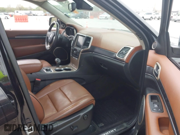 2015 Jeep Grand Cherokee Summit z VIN 1C4RJFJT0FC674494, wystawiony jako IAAI lot #42056835 z przebiegiem 143 969 mil mil oraz . Historia ofert i sprzedaży dostępna na DreamBid. Obrazek 5.