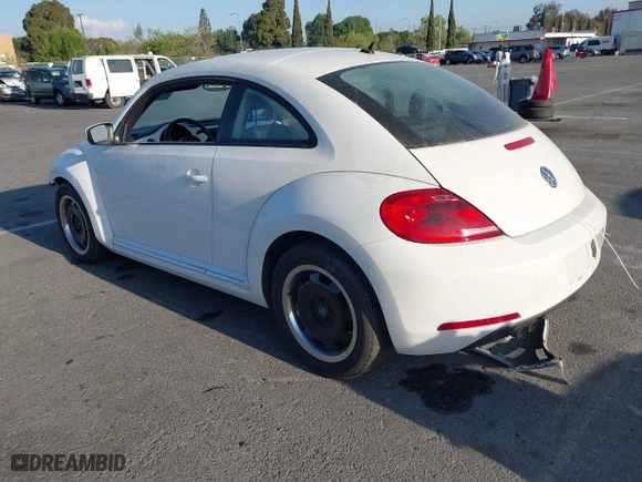 2012 Volkswagen Beetle 2.5L PZEV with VIN 3VWJP7AT3CM664552, listed as a IAAI auction lot 42077635 with 96,195 mi miles. Bid and sale history available at carsss.com. Image 3.