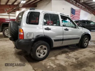 2004 Suzuki Vitara JX z VIN 2S3TD52V546100133, wystawiony jako Copart lot #72629154 z przebiegiem 186 597 mil mil oraz Tytuł czysty. Historia ofert i sprzedaży dostępna na DreamBid. Obrazek 3.