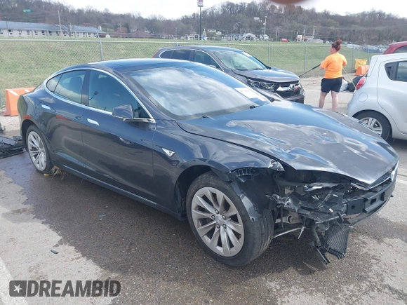 2016 Tesla Model S 70 with VIN 5YJSA1E14GF157118, listed as a IAAI auction lot 41794381 with 53,651 mi miles and . Bid and sale history available at DreamBid. Image 1.