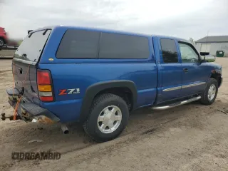 2004 GMC Sierra 1500 SLE z VIN 2GTEK19TX41104508, wystawiony jako Copart lot #56981295 z przebiegiem 180 252 mil mil oraz Czysty tytuł • Clean title. Historia ofert i sprzedaży dostępna na DreamBid. Obrazek 3.