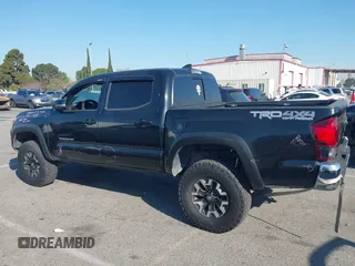 2019 Toyota Tacoma SR z VIN 5TFCZ5AN9KX199814, wystawiony jako IAAI lot #41841821 z przebiegiem 69 276 mil mil oraz . Historia ofert i sprzedaży dostępna na DreamBid. Obrazek 14.