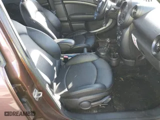 2015 MINI Cooper Countryman S with VIN WMWZC5C55FWP47826, listed as a IAAI auction lot 41342674 with 94,683 mi miles. Bid and sale history available at carsss.com. Image 5.