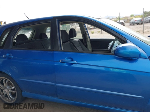 2005 Kia Spectra with VIN KNAFE161655095608, listed as a IAAI auction lot 41990765 with 51,415 mi miles. Bid and sale history available at carsss.com. Image 13.