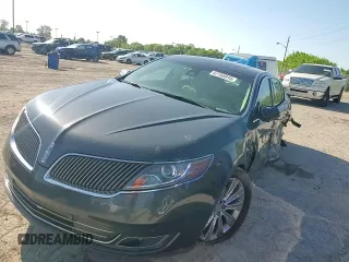 2014 Lincoln MKS EcoBoost z VIN 1LNHL9FT8EG607807, wystawiony jako Copart lot #57755915 z przebiegiem 203 316 mil mil oraz Szkoda całkowita • Salvage title. Historia ofert i sprzedaży dostępna na DreamBid. Obrazek 13.