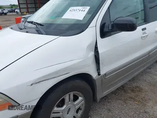 2003 Ford Windstar SEL with VIN 2FMZA53423BA93926, listed as a IAAI auction lot 42537144 with 131,149 mi miles and . Bid and sale history available at DreamBid. Image 6.