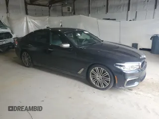 2018 BMW 5 Series M550i xDrive with VIN WBAJB9C58JB035267, listed as a Copart auction lot 64616605 with 125,365 mi miles and Clean title. Bid and sale history available at DreamBid. Image 4.