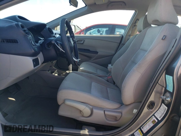 2010 Honda Insight EX with VIN JHMZE2H73AS039935, listed as a Copart auction lot 46192575 with 127,329 mi miles and Salvage Title. Bid and sale history available at DreamBid. Image 7.