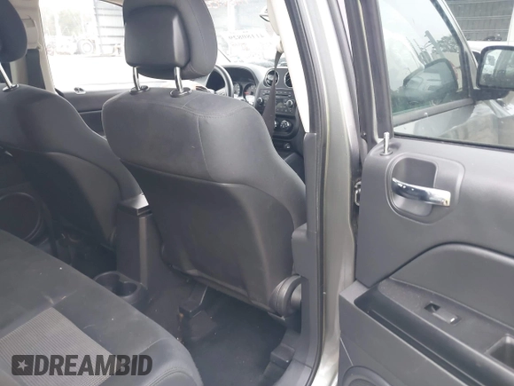 2012 Jeep Compass Sport with VIN 1C4NJCBB7CD664599, listed as a IAAI auction lot 41180829 with 144,909 mi miles. Bid and sale history available at carsss.com. Image 8.