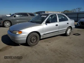 1996 Hyundai Accent z VIN KMHVF14N4TU316378, wystawiony jako Copart lot #88981945 z przebiegiem 128 650 mil mil oraz Tytuł czysty. Historia ofert i sprzedaży dostępna na DreamBid. Obrazek 1.