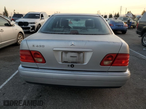 1997 Mercedes-Benz E-Class with VIN WDBJF72F4VA566949, listed as a Copart auction lot 81000554 with 187,409 mi miles and Salvage Title. Bid and sale history available at carsss.com. Image 6.
