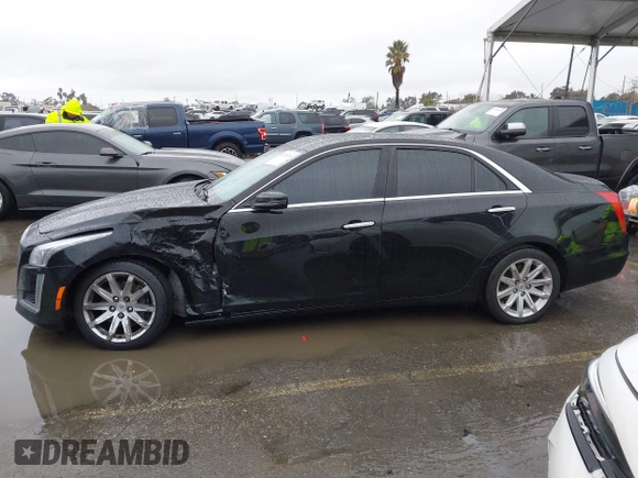 2014 Cadillac CTS Luxury AWD with VIN 1G6AX5SX3E0156938, listed as a IAAI auction lot 41574318 with 151,585 mi miles and . Bid and sale history available at DreamBid. Image 14.