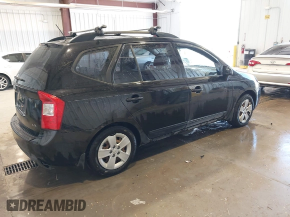 2009 Kia Rondo LX with VIN KNAFG528297278647, listed as a IAAI auction lot 42139810 with 161,314 mi miles. Bid and sale history available at carsss.com. Image 4.