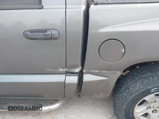 2007 Dodge Dakota SLT z VIN 1D7HW48P57S216313, wystawiony jako IAAI lot #41319321 z przebiegiem 116 712 mil mil oraz . Historia ofert i sprzedaży dostępna na DreamBid. Obrazek 12.