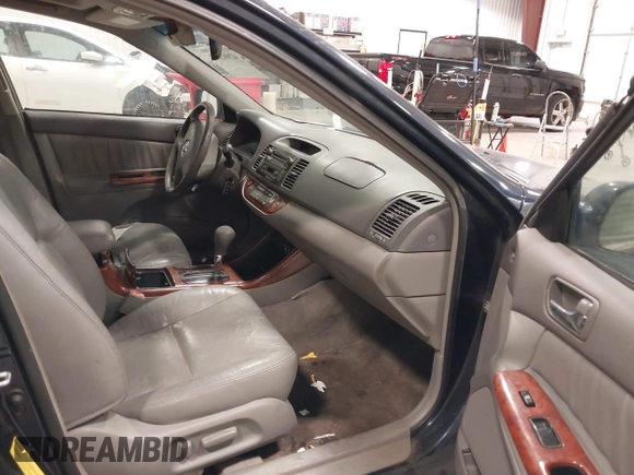 2003 Toyota Camry LE with VIN 4T1BE30K03U152348, listed as a IAAI auction lot 42082892 with 224,721 mi miles and . Bid and sale history available at DreamBid. Image 5.