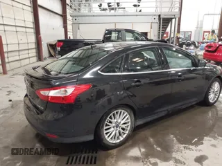 2014 Ford Focus Titanium with VIN 1FADP3J22EL199563, listed as a IAAI auction lot 41450106 with 129,271 mi miles. Bid and sale history available at carsss.com. Image 4.
