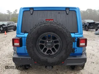 2023 Jeep Wrangler Sport S with VIN 1C4HJXDGXPW692324, listed as a Copart auction lot 41761235 with 15,660 mi miles and Salvage Title. Bid and sale history available at DreamBid. Image 6.