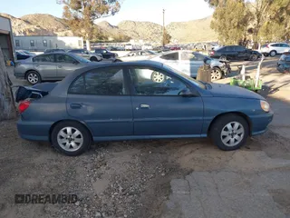2002 Kia Rio with VIN KNADC123826128733, listed as a IAAI auction lot 41643123 with 101,433 mi miles. Bid and sale history available at carsss.com. Image 13.