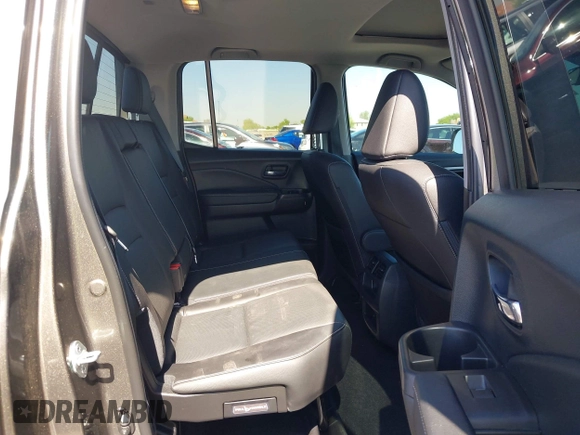 2022 Honda Ridgeline RTL with VIN 5FPYK3F58NB007618, listed as a IAAI auction lot 42258443 with 14,036 mi miles and . Bid and sale history available at DreamBid. Image 8.