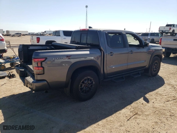 2022 Nissan Frontier PRO-X with VIN 1N6ED1EJ4NN687038, listed as a Copart auction lot 74777834 with 2,180 mi miles and Salvage Title. Bid and sale history available at carsss.com. Image 3.