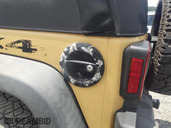 2013 Jeep Wrangler Sport with VIN 1C4AJWAG1DL672816, listed as a IAAI auction lot 42597238 with 105,910 mi miles and . Bid and sale history available at DreamBid. Image 6.