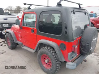 1998 Jeep Wrangler SE with VIN 1J4FY29P2WP791317, listed as a IAAI auction lot 41748523 with 169,052 mi miles. Bid and sale history available at carsss.com. Image 3.