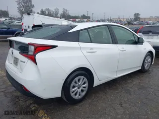 2021 Toyota Prius L Eco with VIN JTDKAMFU6M3141019, listed as a IAAI auction lot 41821212 with 202,756 mi miles. Bid and sale history available at carsss.com. Image 4.