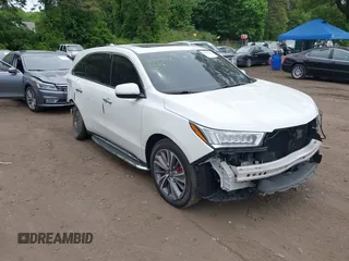 2018 Acura MDX Technology z VIN 5J8YD4H54JL026858, wystawiony jako IAAI lot #42349391 z przebiegiem 50 409 mil mil oraz . Historia ofert i sprzedaży dostępna na DreamBid. Obrazek 1.