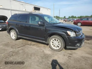 2013 Dodge Journey SXT with VIN 3C4PDCBG4DT619319, listed as a Copart auction lot 62964135 with 140,620 mi miles and Salvage title. Bid and sale history available at DreamBid. Image 4.