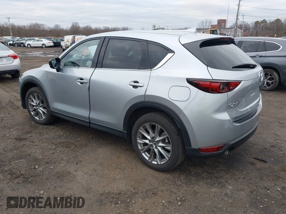2020 Mazda CX-5 Grand Touring with VIN JM3KFBDM4L0843825, listed as a IAAI auction lot 41733575 with 18,800 mi miles. Bid and sale history available at carsss.com. Image 3.