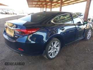 2016 Mazda 6 i Touring with VIN JM1GJ1T5XG1434388, listed as a IAAI auction lot 41528124 with 99,293 mi miles and . Bid and sale history available at DreamBid. Image 4.