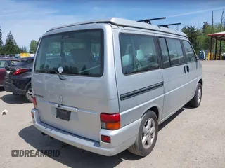 2003 Volkswagen EuroVan MV with VIN WV2NB47003H003131, listed as a IAAI auction lot 42157821 with 166,159 mi miles and . Bid and sale history available at DreamBid. Image 4.