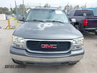 2001 GMC Yukon SLE z VIN 1GKEC13T91R205942, wystawiony jako IAAI lot #42207894 z przebiegiem 265 808 mil mil oraz . Historia ofert i sprzedaży dostępna na DreamBid. Obrazek 13.