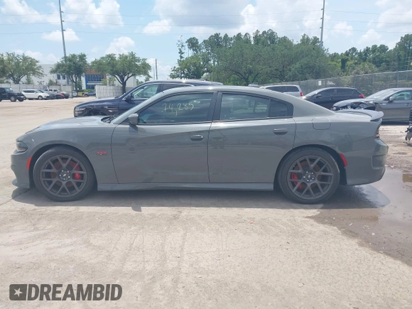 2019 Dodge Charger Scat Pack with VIN 2C3CDXGJ2KH633854, listed as a IAAI auction lot 42212517 with 74,285 mi miles and . Bid and sale history available at DreamBid. Image 14.