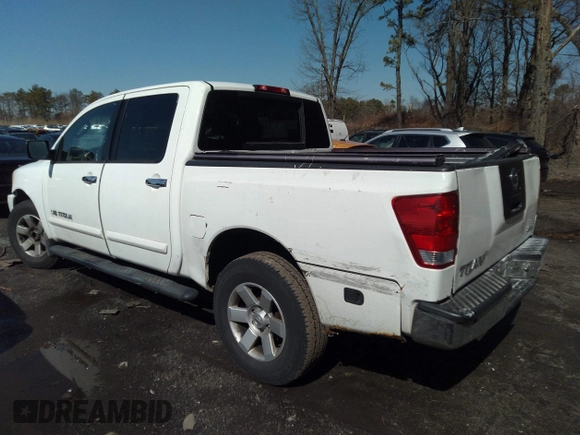 2005 Nissan Titan SE with VIN 1N6AA07B25N514643, listed as a IAAI auction lot 32638857 with 214,304 mi miles. Bid and sale history available at carsss.com. Image 3.