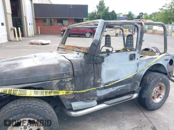 2000 Jeep Wrangler Sport with VIN 1J4FA49S5YP797345, listed as a IAAI auction lot 40322775 with Not Provided miles and . Bid and sale history available at DreamBid. Image 14.