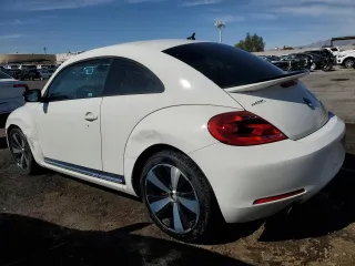 2012 Volkswagen Beetle 2.0T Turbo w/Sun/Snd/Nav PZEV with VIN 3VWVA7AT4CM654695, listed as a Copart auction lot 52117685 with 107,203 mi miles and Clean Title. Bid and sale history available at carsss.com. Image 2.
