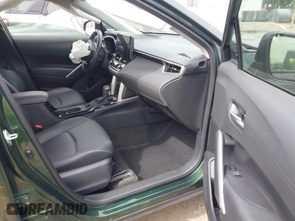 2023 Toyota Corolla Cross XLE with VIN 7MUEAAAG9PV053569, listed as a IAAI auction lot 42319709 with 71,105 mi miles and . Bid and sale history available at DreamBid. Image 5.