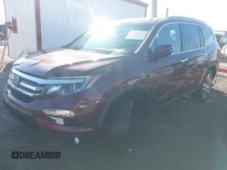 2016 Honda Pilot Touring with VIN 5FNYF6H90GB126572, listed as a IAAI auction lot 41872113 with 94,318 mi miles. Bid and sale history available at carsss.com. Image 2.