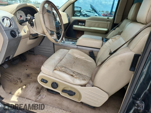 2004 Ford F-150 XL with VIN 1FTPX12564NA87792, listed as a Copart auction lot 60489655 with 396,269 mi miles and Salvage title. Bid and sale history available at DreamBid. Image 7.