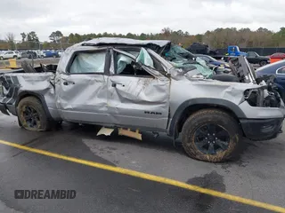 2021 Ram 1500 Rebel with VIN 1C6SRFLT0MN734774, listed as a IAAI auction lot 41075676 with 95,808 mi miles and . Bid and sale history available at DreamBid. Image 6.