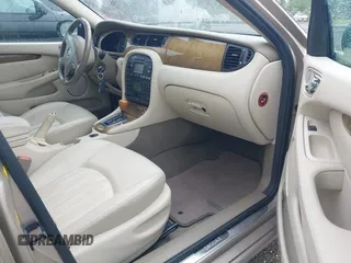 2003 Jaguar X-Type 2.5L Manual z VIN SAJEA51D53XC94089, wystawiony jako IAAI lot #42370566 z przebiegiem 81 687 mil mil oraz . Historia ofert i sprzedaży dostępna na DreamBid. Obrazek 5.