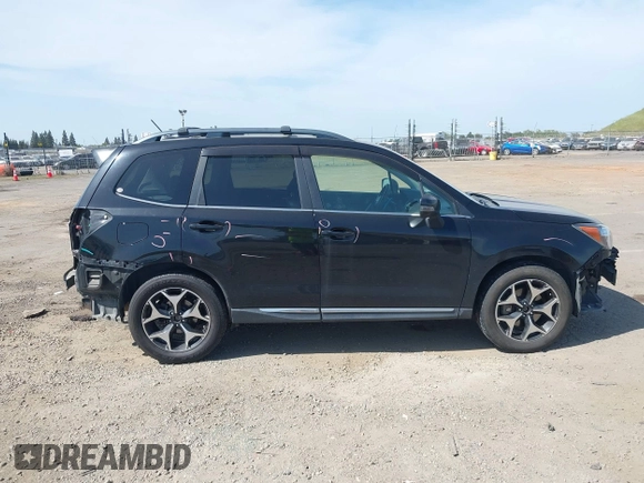 2015 Subaru Forester XT Touring with VIN JF2SJGUC5FH822632, listed as a IAAI auction lot 42032965 with 118,111 mi miles and . Bid and sale history available at DreamBid. Image 14.