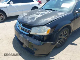 2014 Dodge Avenger SE with VIN 1C3CDZAB1EN133550, listed as a IAAI auction lot 42033001 with 137,592 mi miles. Bid and sale history available at carsss.com. Image 6.