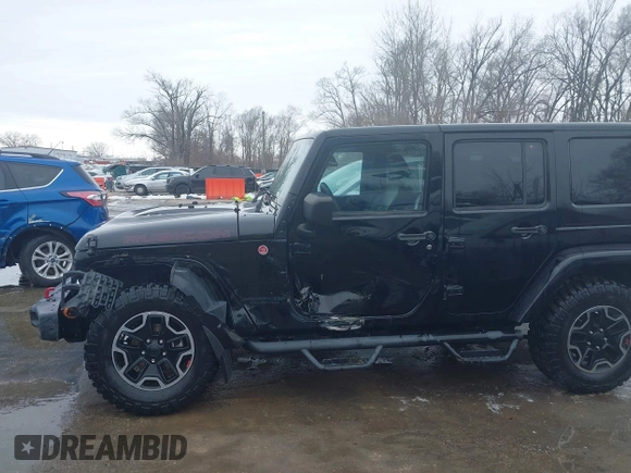 2015 Jeep Wrangler Unlimited Rubicon Hard Rock with VIN 1C4HJWFG9FL569962, listed as a IAAI auction lot 41557801 with 78,597 mi miles and . Bid and sale history available at DreamBid. Image 6.