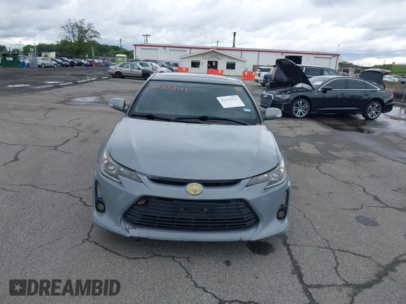 2014 Scion tC z VIN JTKJF5C71E3081033, wystawiony jako IAAI lot #42333111 z przebiegiem 144 124 mil mil oraz . Historia ofert i sprzedaży dostępna na DreamBid. Obrazek 6.