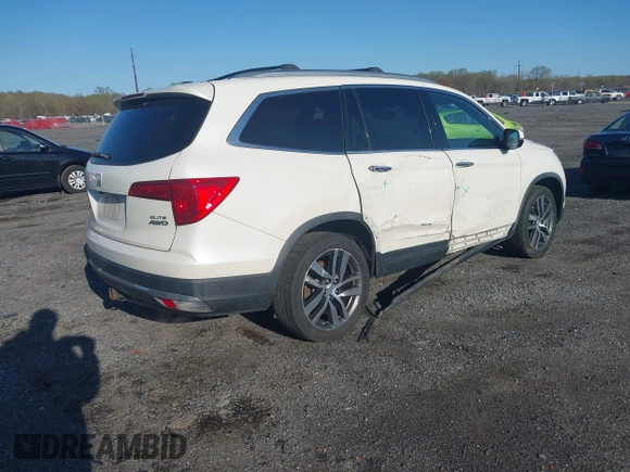 2017 Honda Pilot Elite with VIN 5FNYF6H00HB032386, listed as a IAAI auction lot 41976702 with 153,251 mi miles and . Bid and sale history available at DreamBid. Image 4.
