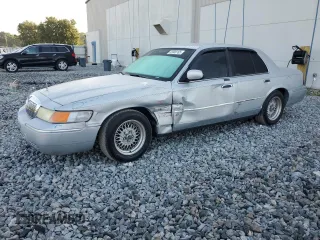 1999 Mercury Grand Marquis LS with VIN 2MEFM75WXXX682027, listed as a Copart auction lot 53906165 with 116,616 mi miles and Salvage Title. Bid and sale history available at DreamBid. Image 1.