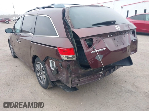 2014 Honda Odyssey Touring with VIN 5FNRL5H97EB117971, listed as a IAAI auction lot 41794324 with 198,191 mi miles and . Bid and sale history available at DreamBid. Image 3.